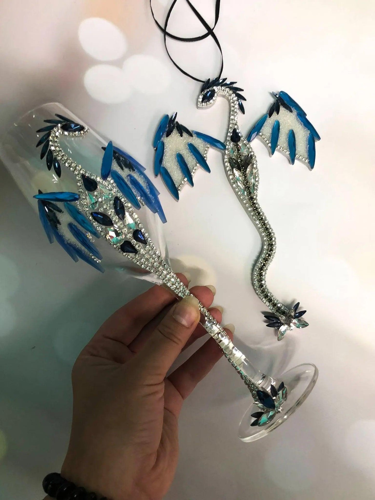 A Toast to Luxury: Dragon-adorned Champagne Glass with Navy Crystal Accents.