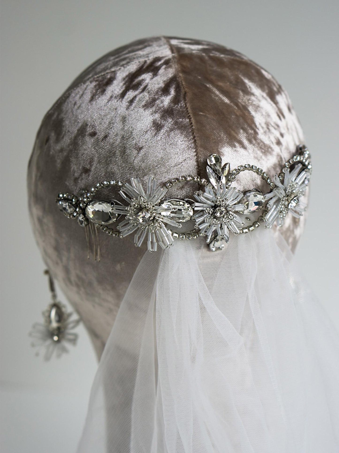 Close-up of the Gloriosa bridal flower hair comb with beaded flowers and crystal chains