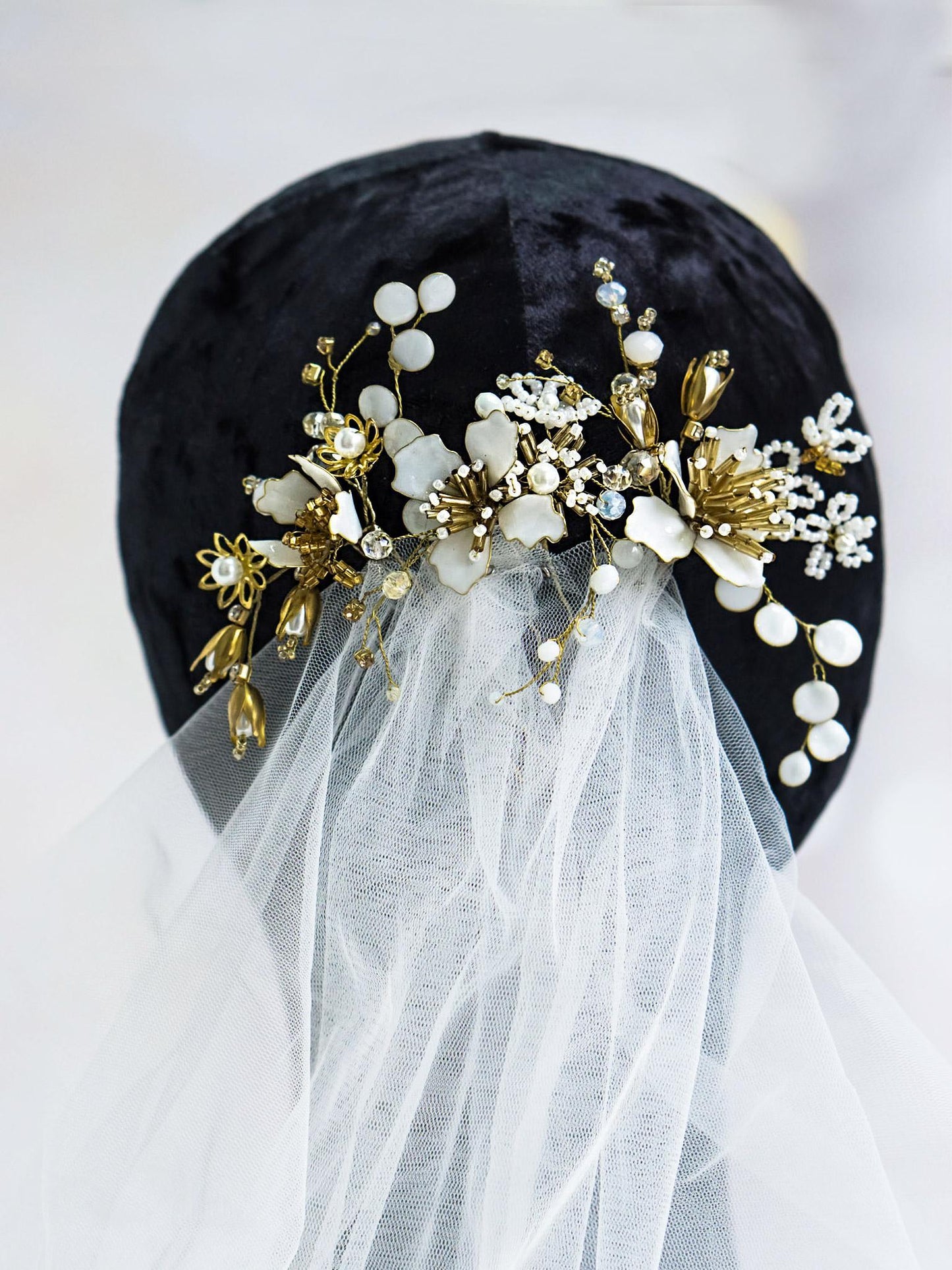 White floral hair pin with pearl and crystal bead details
