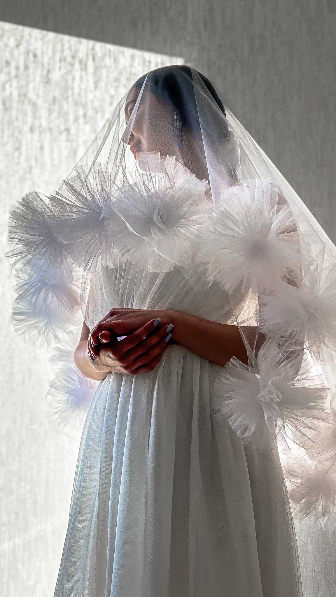 Romantic wedding veil with oversized pom-poms