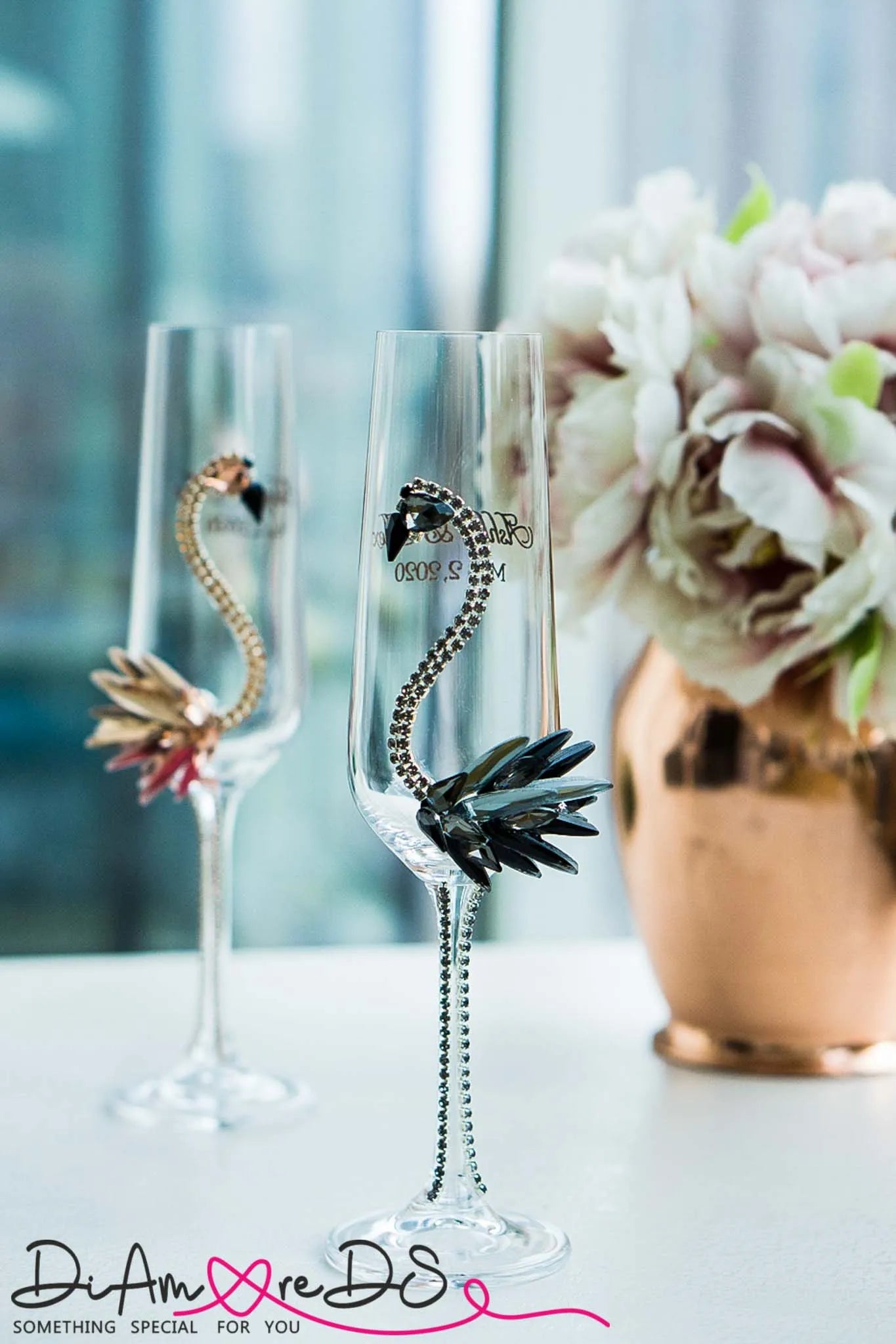 Elegant champagne flutes with flamingos 