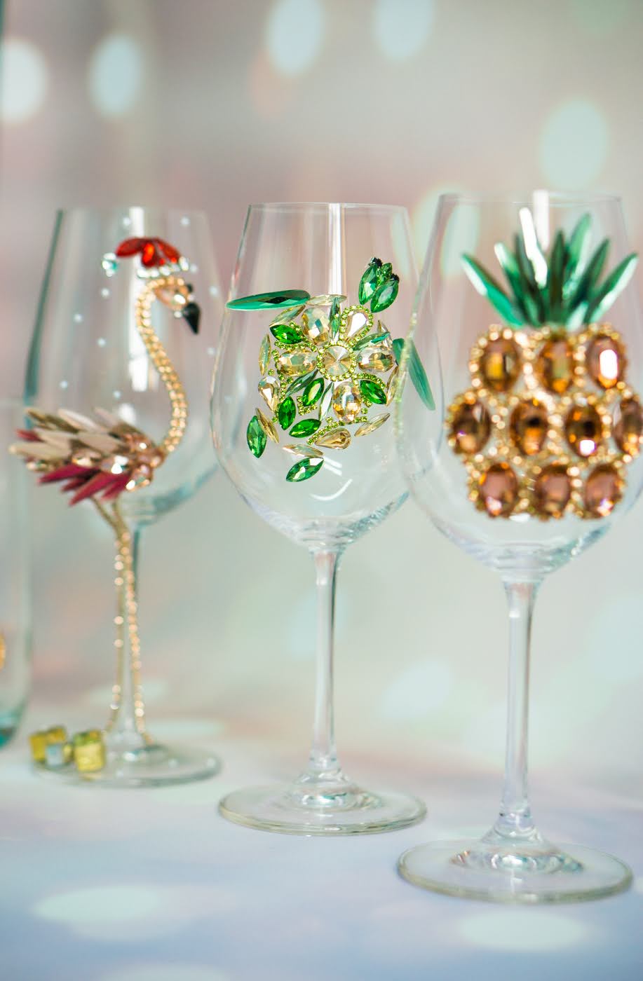 Tropical-themed wine glass with a dazzling rose gold pineapple, symbolizing warmth and hospitality