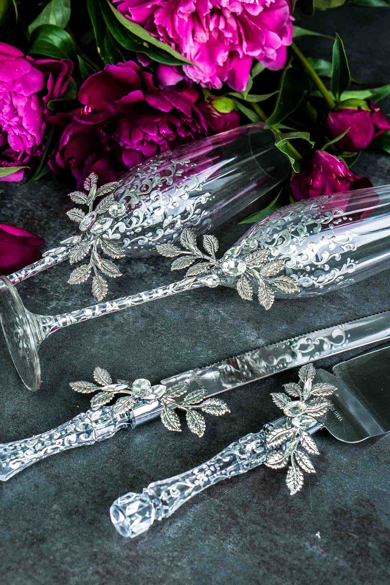 Stylish silver wedding flutes and cake server ensemble