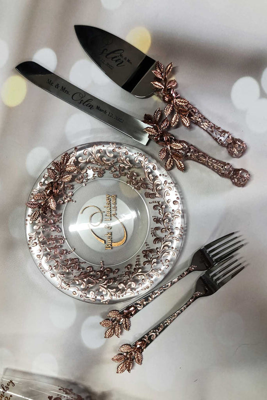 Rose gold cake server and plate with forks