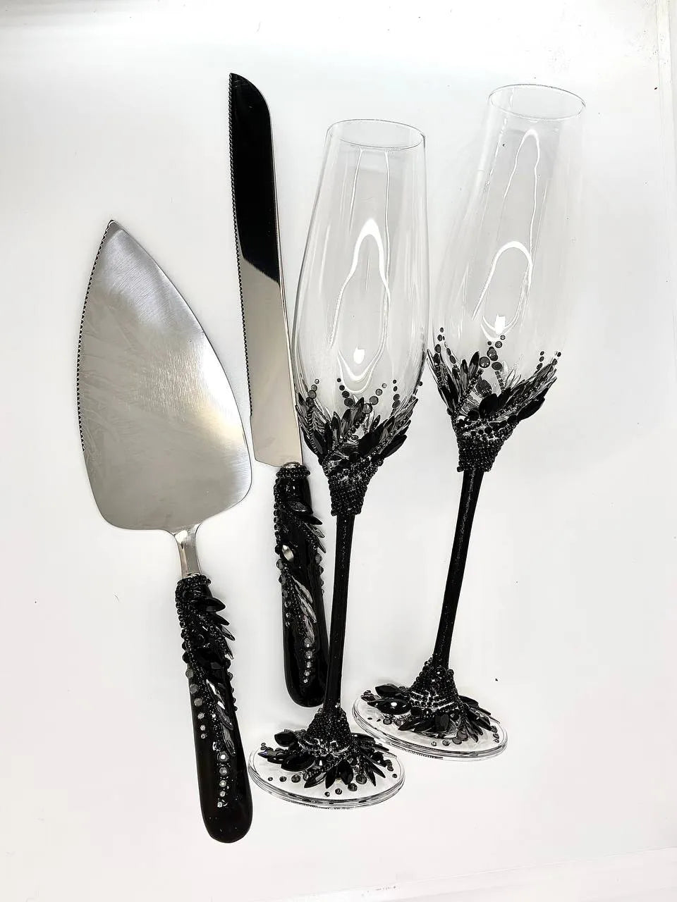 Black crystal-adorned toasting flutes and cake server set