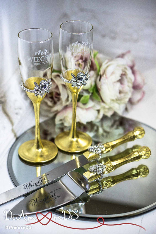 Gold and silver wedding cake knife and champagne glasses set