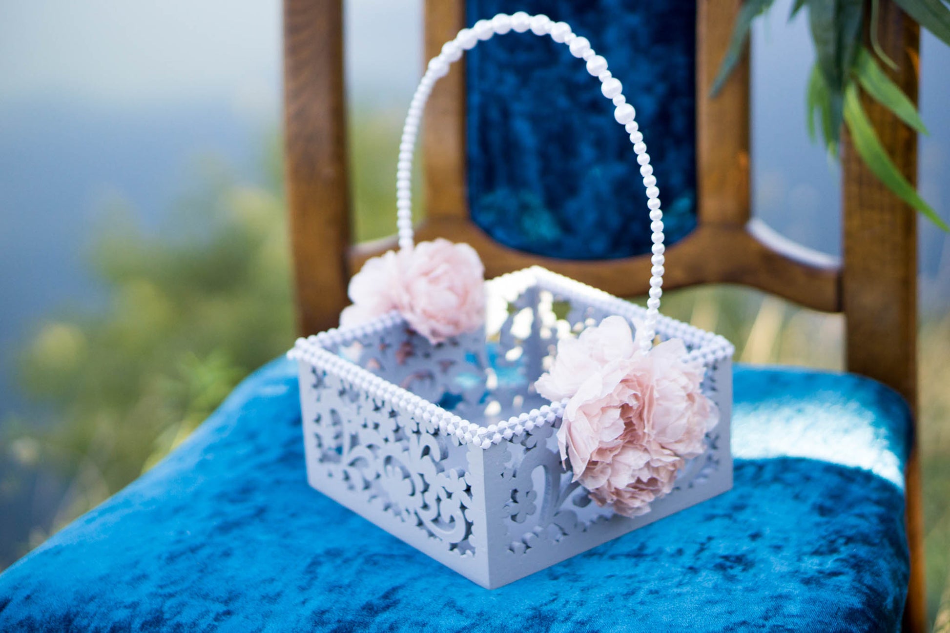 Elegant wooden basket for flower girls adorned with pearls