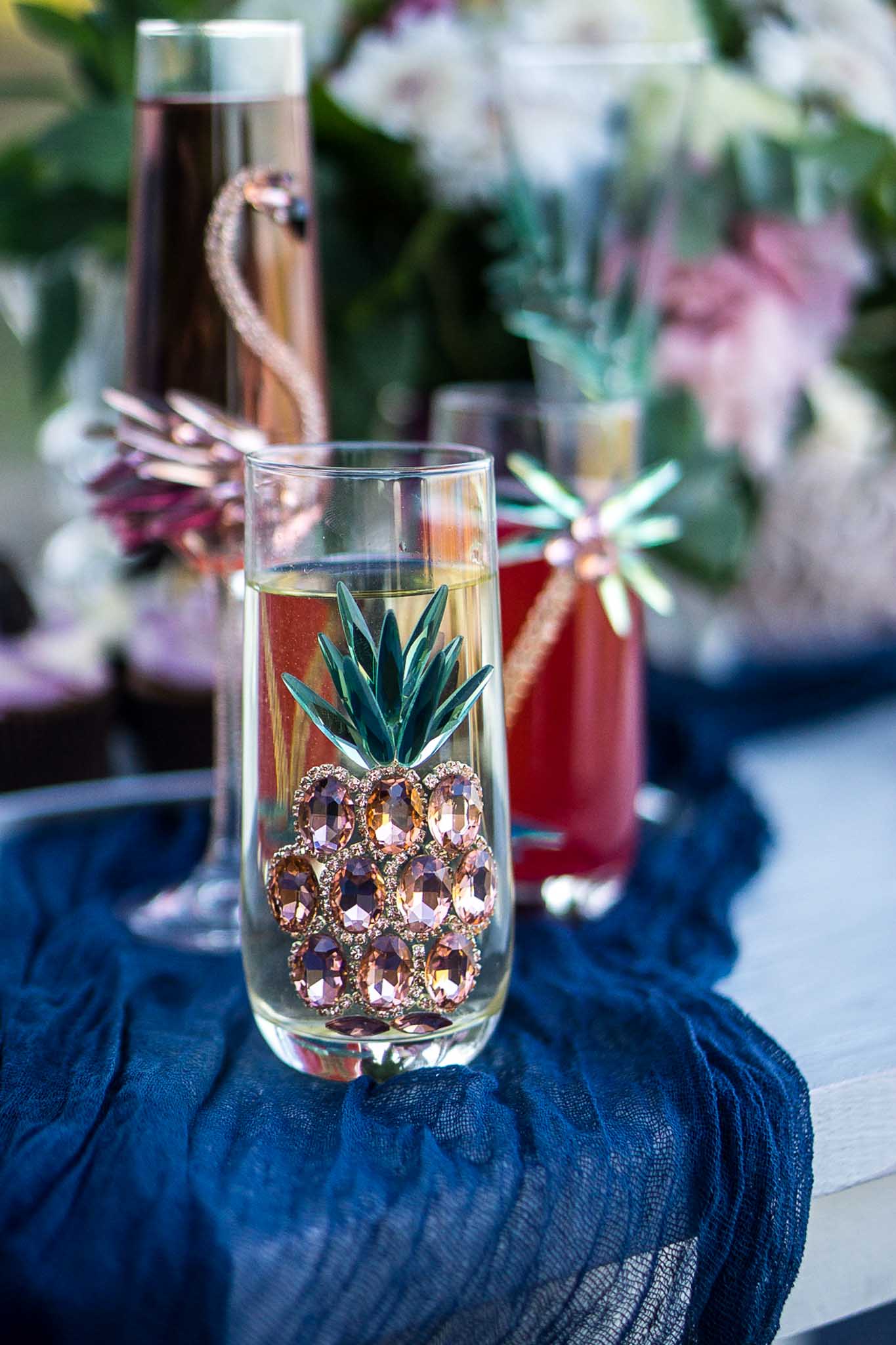 Artisanal wine glass featuring a crystal pineapple pattern, merging exquisite craftsmanship with tropical elegance.