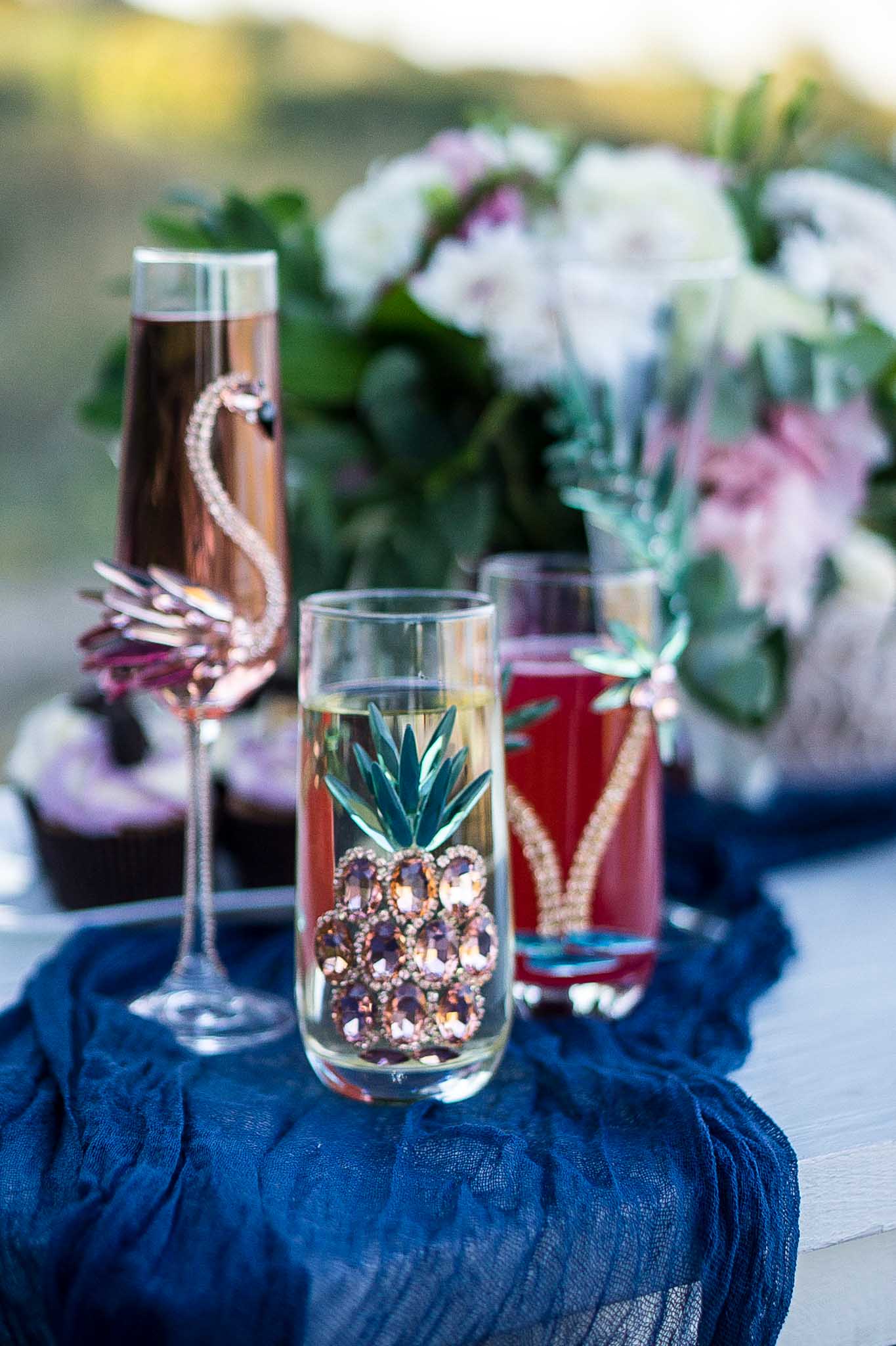 Engravable crystal champagne flute with pineapple embellishment, a special gift for lovers of bespoke tropical aesthetics.