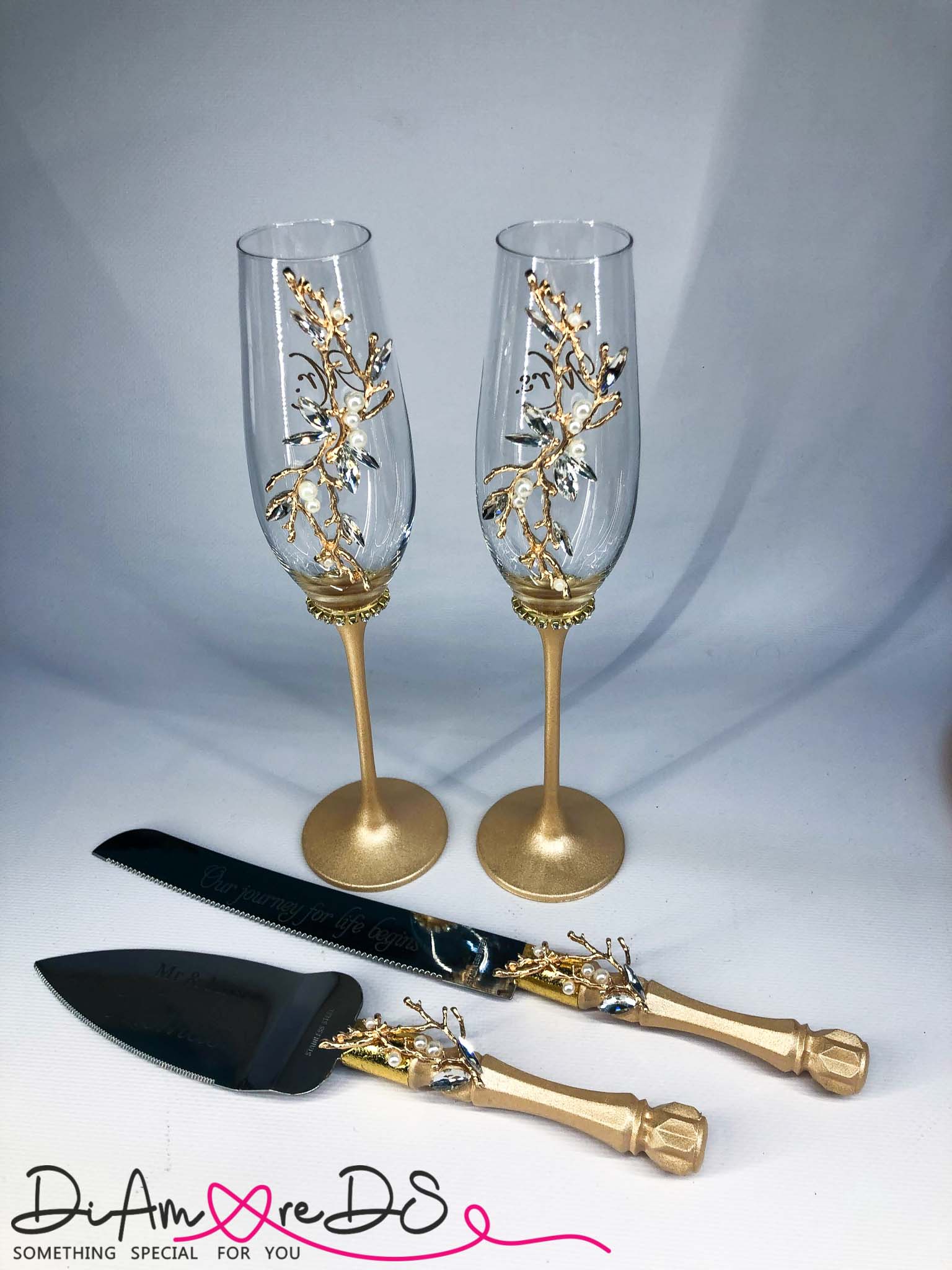 Personalized gold champagne flutes and server