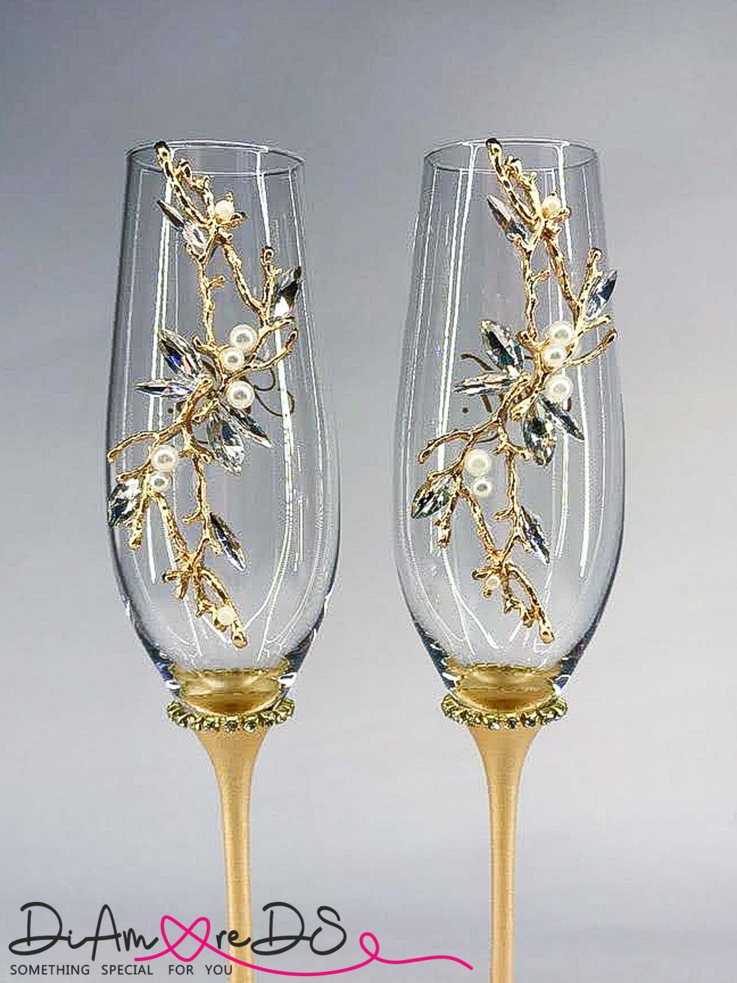 Elegant wedding glasses and cake set with gold accents