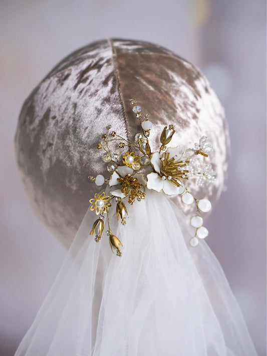 Bride's hair with two gold flower hair pins featuring Czech crystal beads