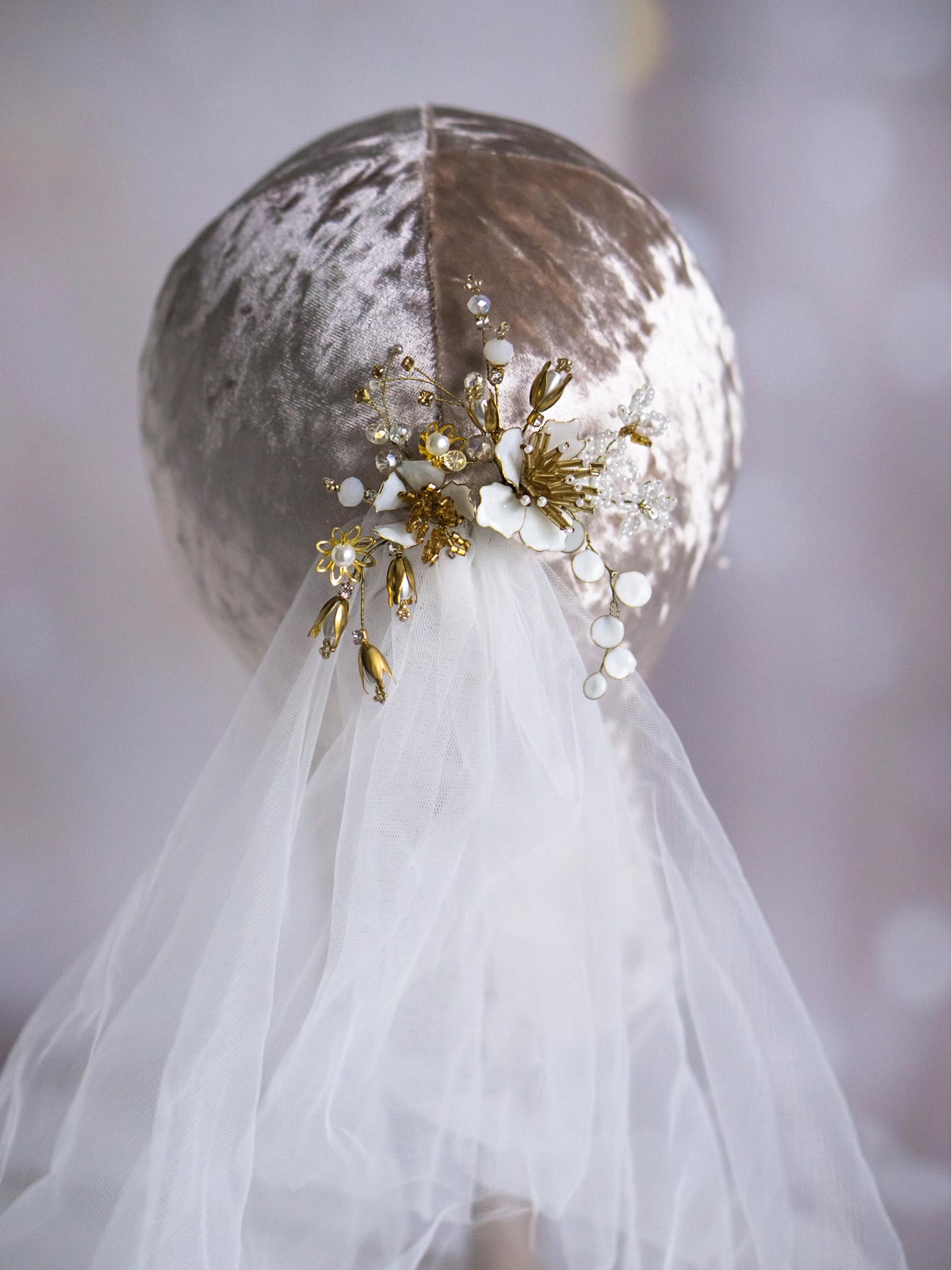 Gold hair pin with delicate white flowers