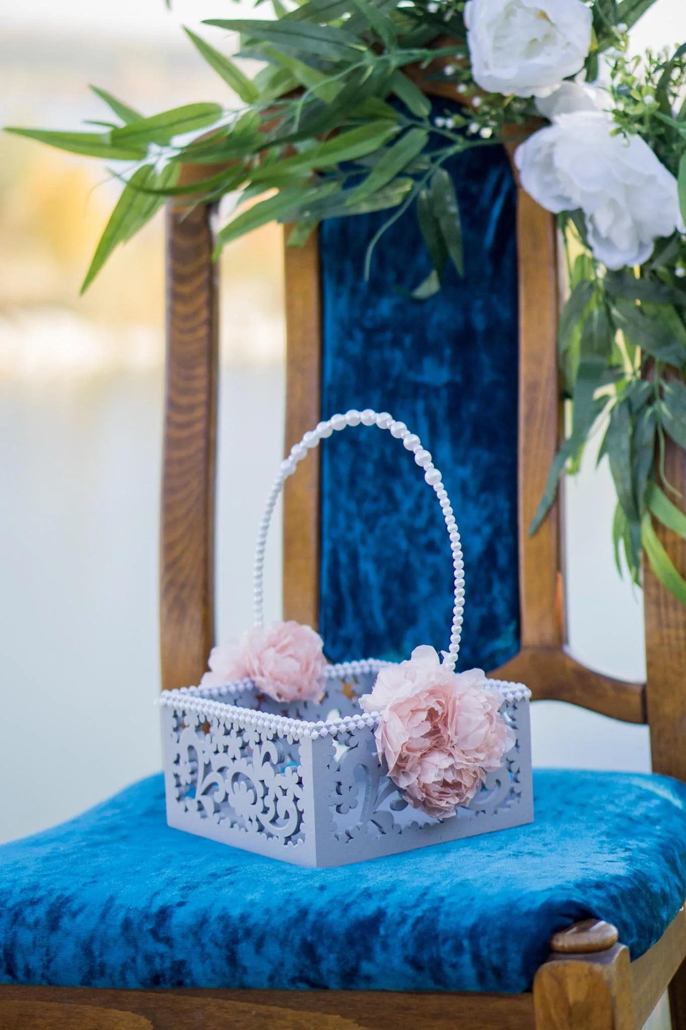 Wooden flower girl basket with intricate pearl handle for a touch of sophistication