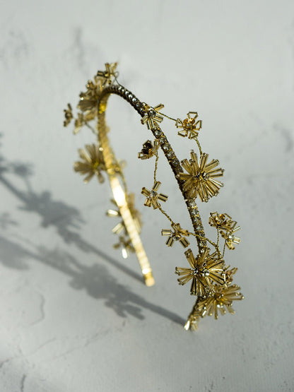Rustic wedding headpiece with delicate flowers and gold band