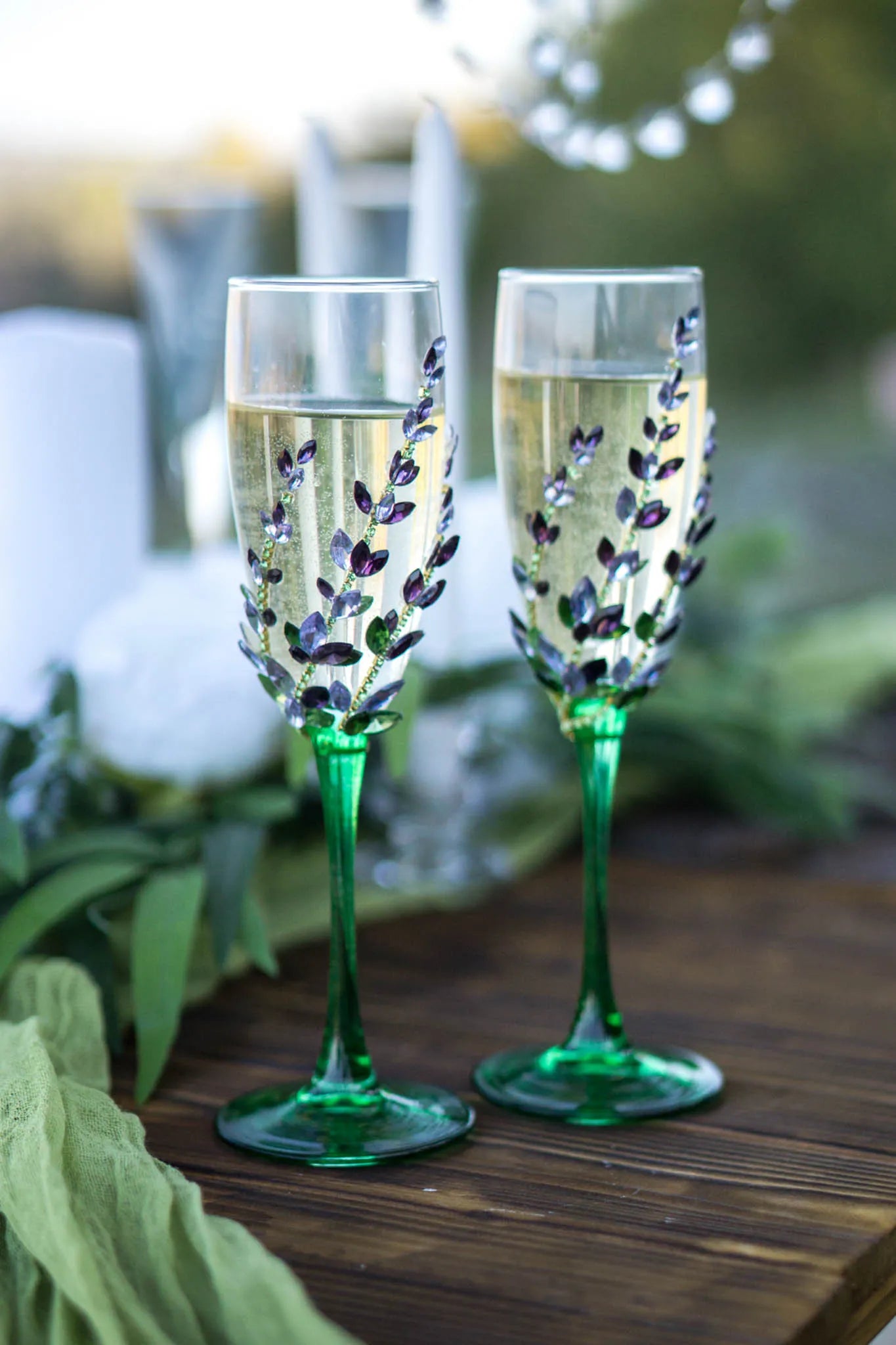 Wedding champagne flutes and cake servers featuring crystals and wildflowers