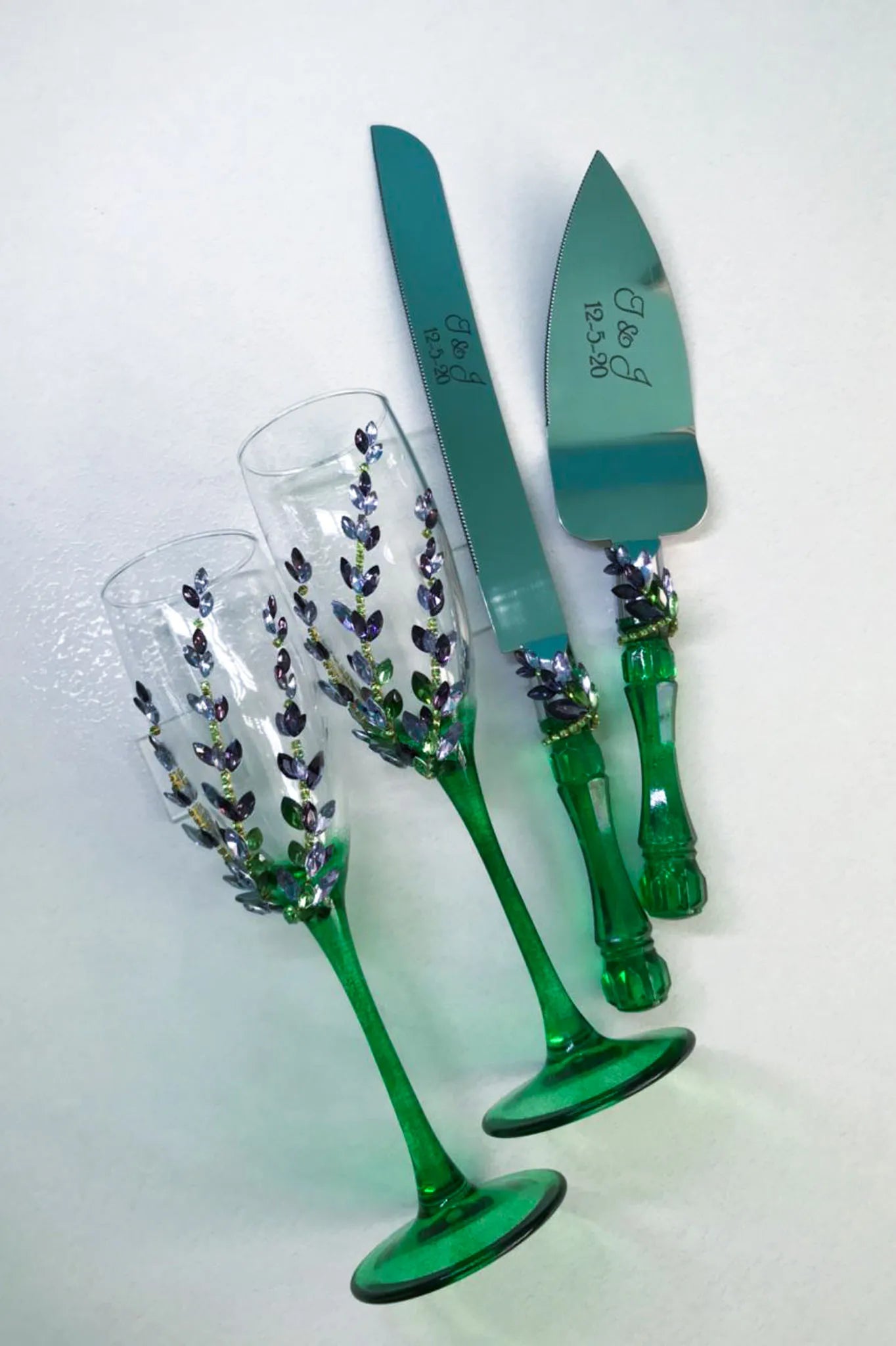 Elegant wedding glasses and cake server sets adorned with crystals and wildflowers
