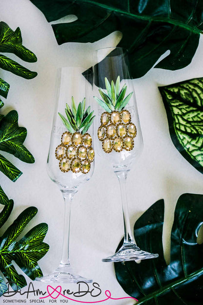 Handcrafted crystal champagne flute with an intricate pineapple design, perfect for tropical-themed weddings
