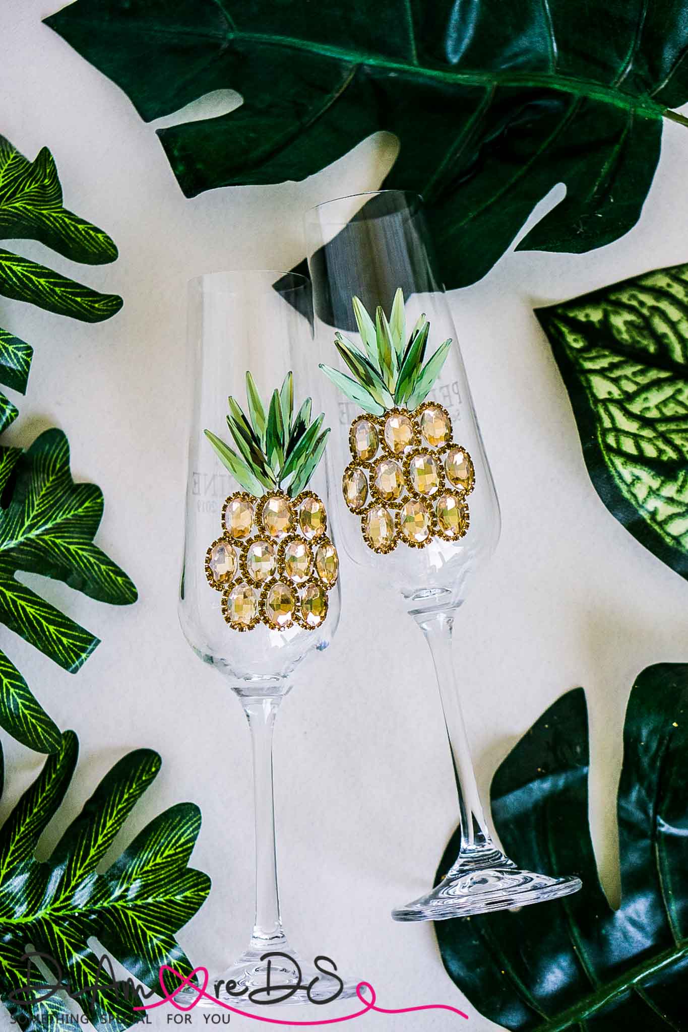 Bespoke champagne flute with a handcrafted pineapple design, a sophisticated addition to tropical decor."