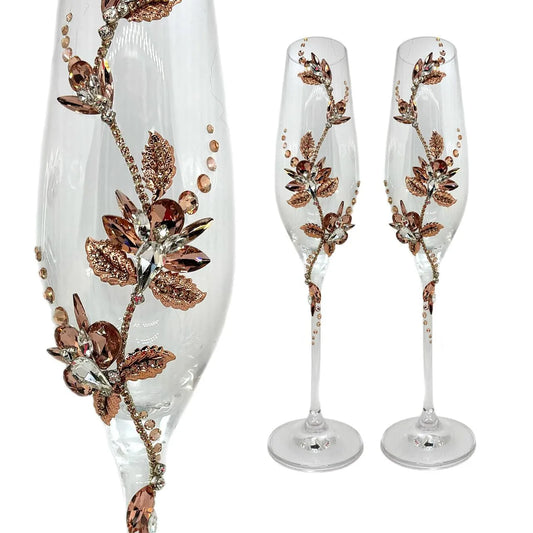 Rose gold-tone champagne glasses perfect for garden-themed weddings