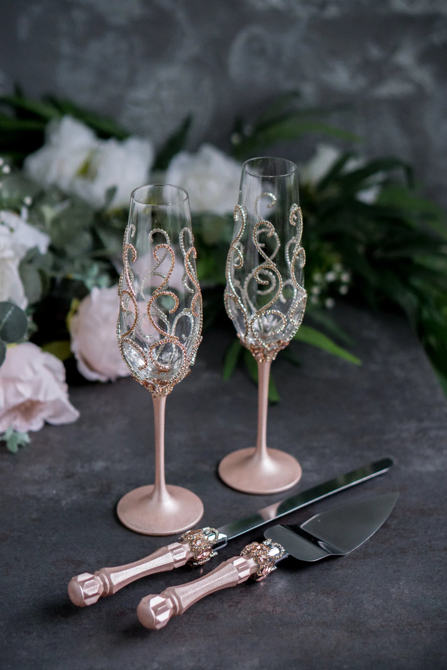 Elegant rose gold wedding champagne flutes and custom cake serving se