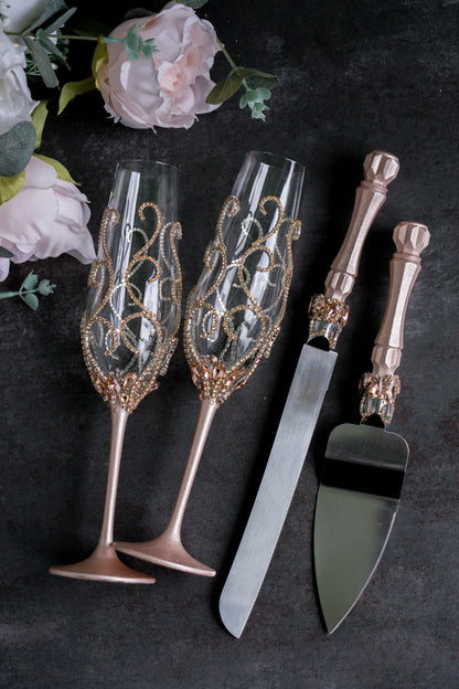 Wedding champagne flutes and cake server with rose gold crystals and engraving