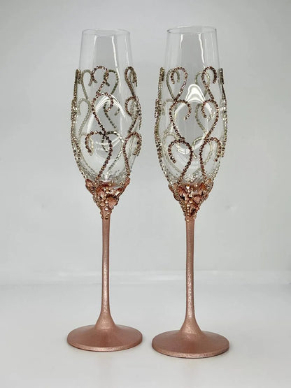 Rose gold rhinestone-adorned champagne flutes for weddings