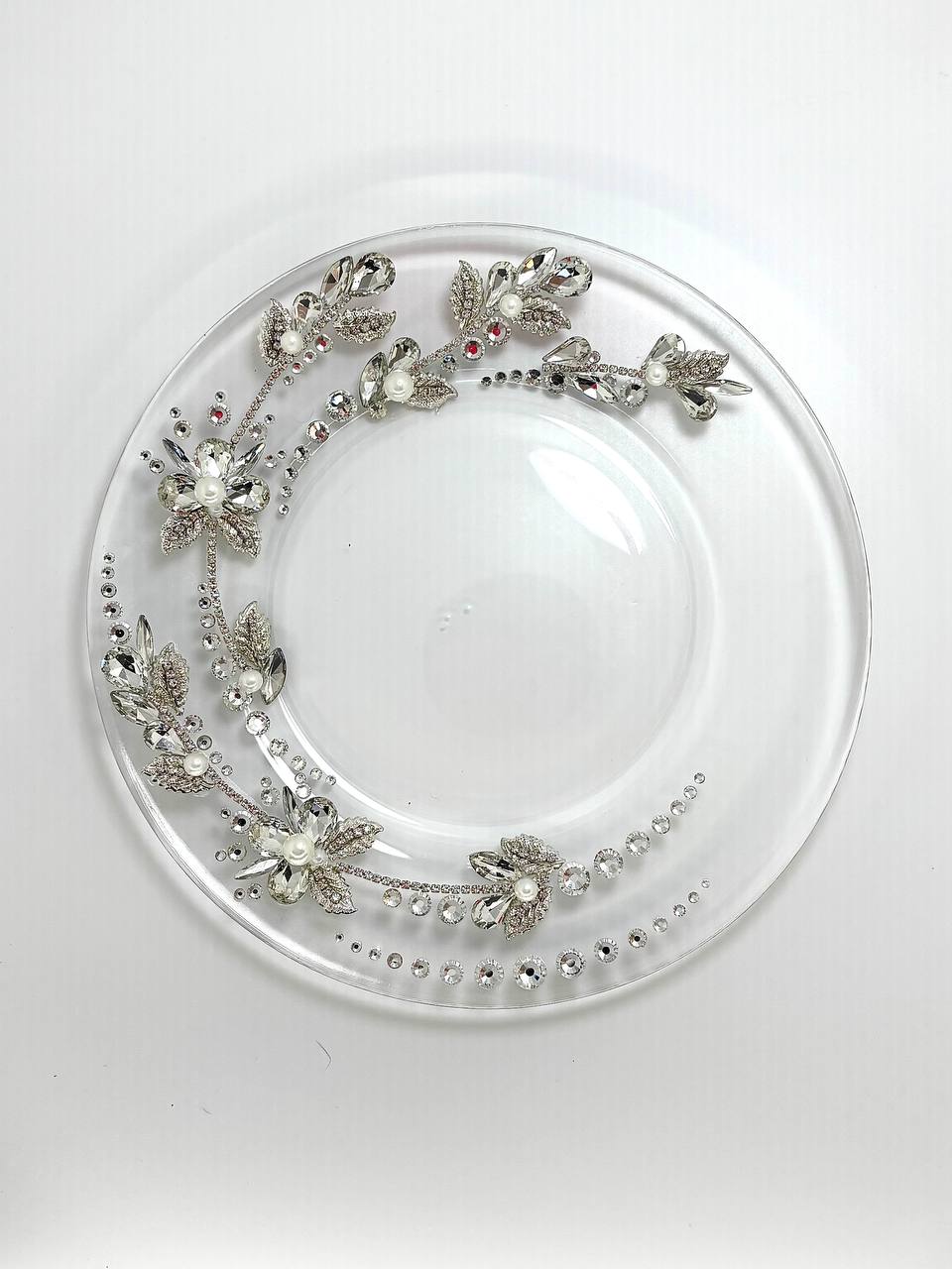 Elegant cake plate with sleek silver-toned finish and floral motif