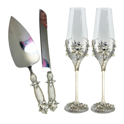 Beautifully crafted cake cutter and  server set champagne glasses with shimmering crystals and metallic leaves