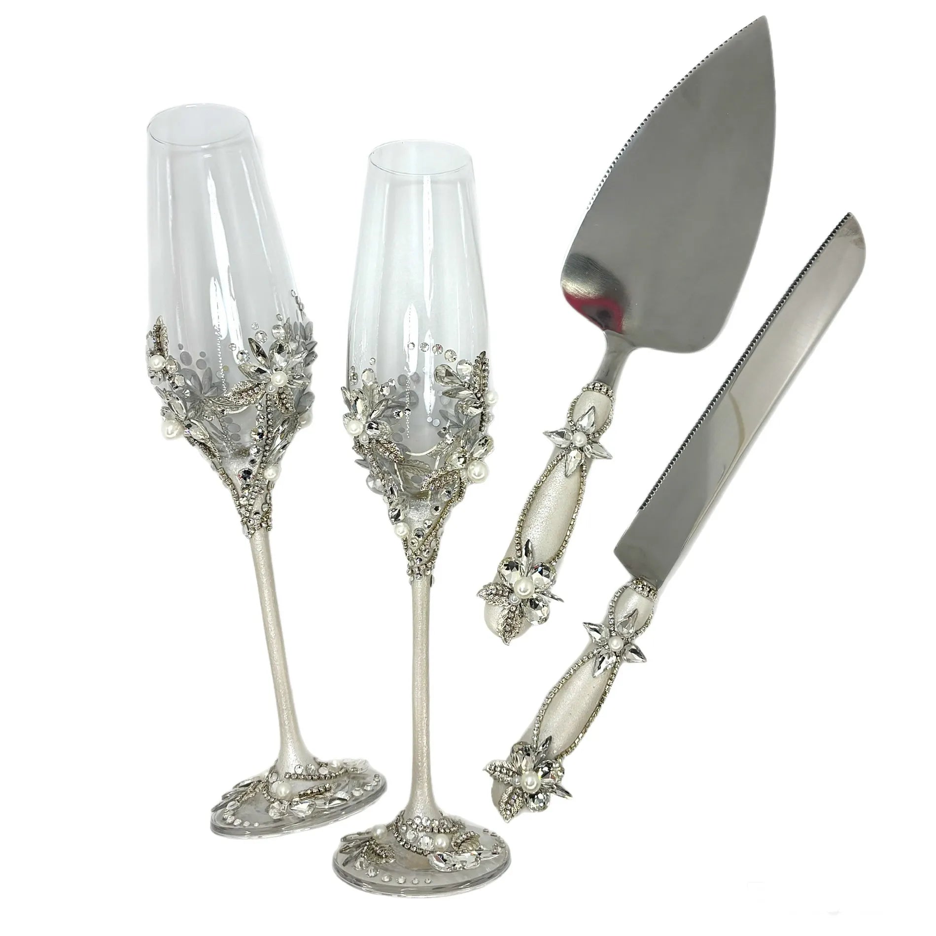 Custom engraved cake servers and toasting flutes as wedding keepsakes