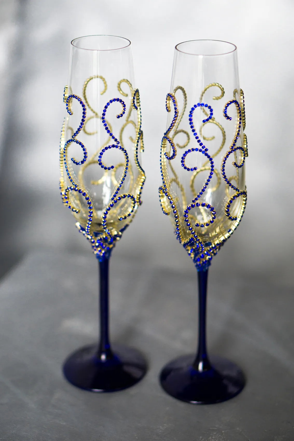 Gold and royal blue  wedding champagne flutes ideal for gifting and keepsakes.