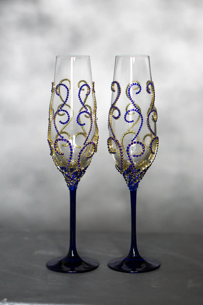 Personalized wedding toasting flutes in gold and royal blue hues