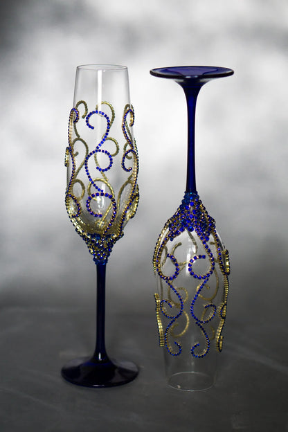 Elegant wedding champagne flutes with intricate rhinestone accents.