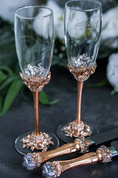 Sophisticated rose gold wedding flutes and serving utensils