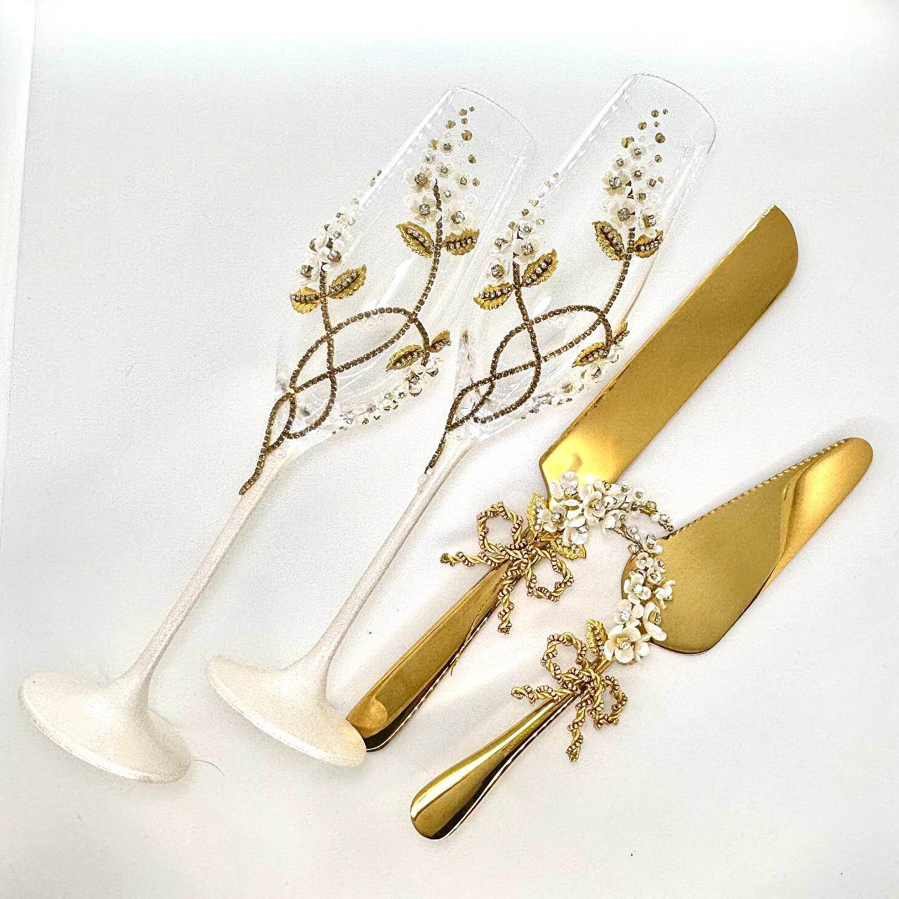 Personalized wedding champagne flutes and gold cake server sets with floral designs