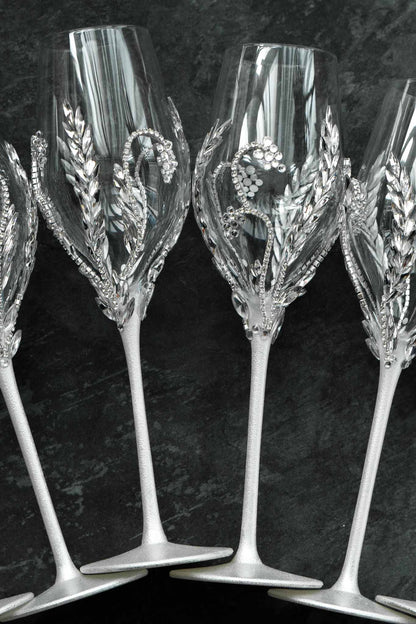 Handcrafted wedding flutes with shimmering crystals