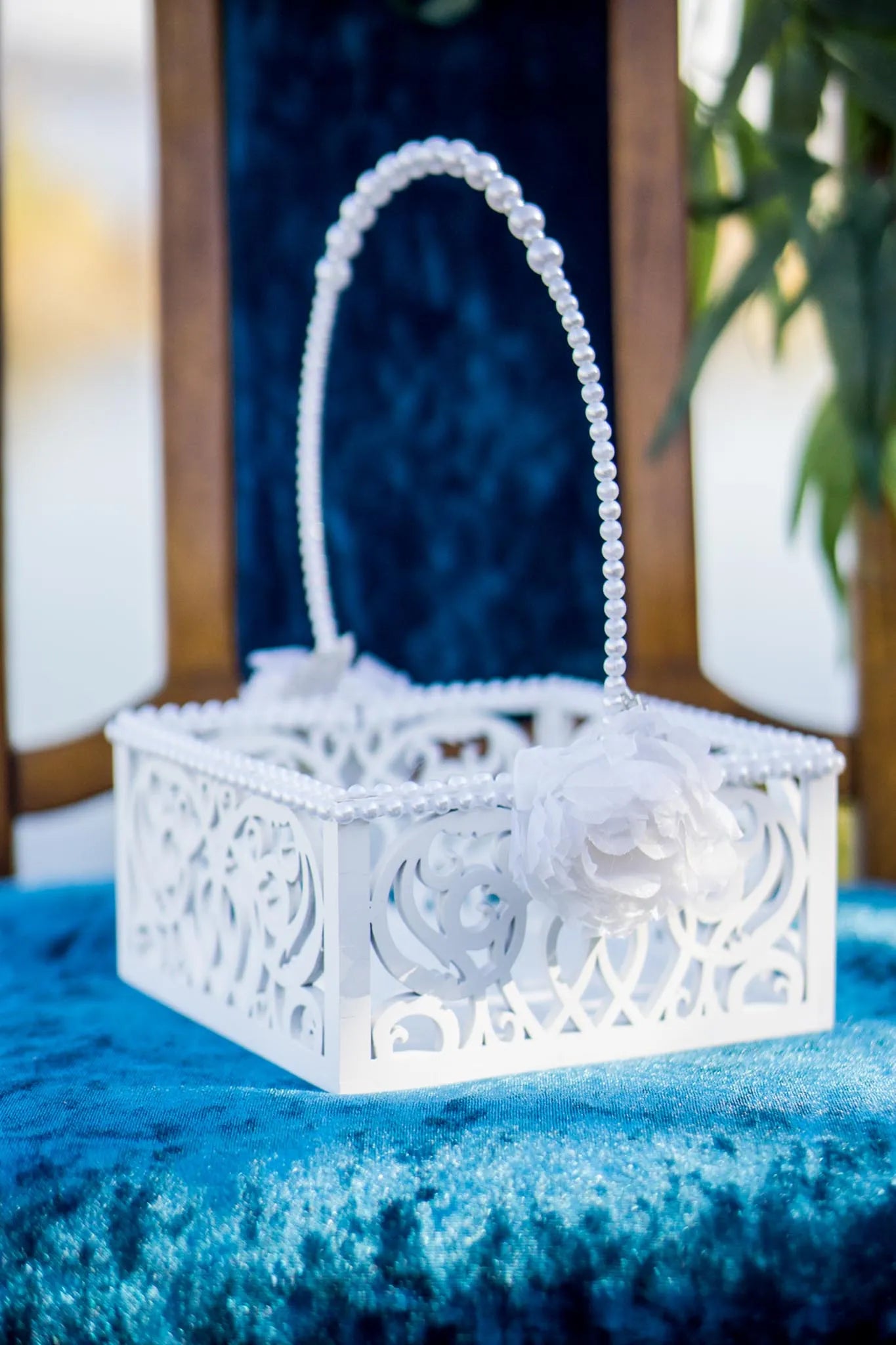 Pearl flower girl basket for a whimsical wedding ceremony