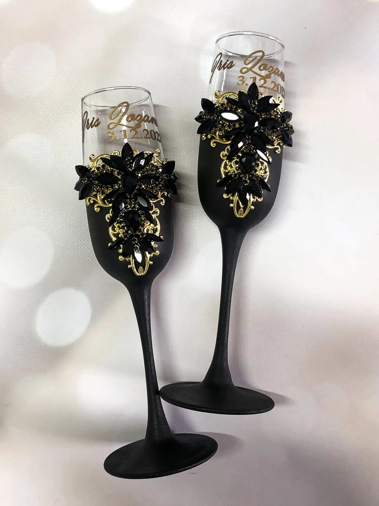 Engraved champagne flutes in black and gold