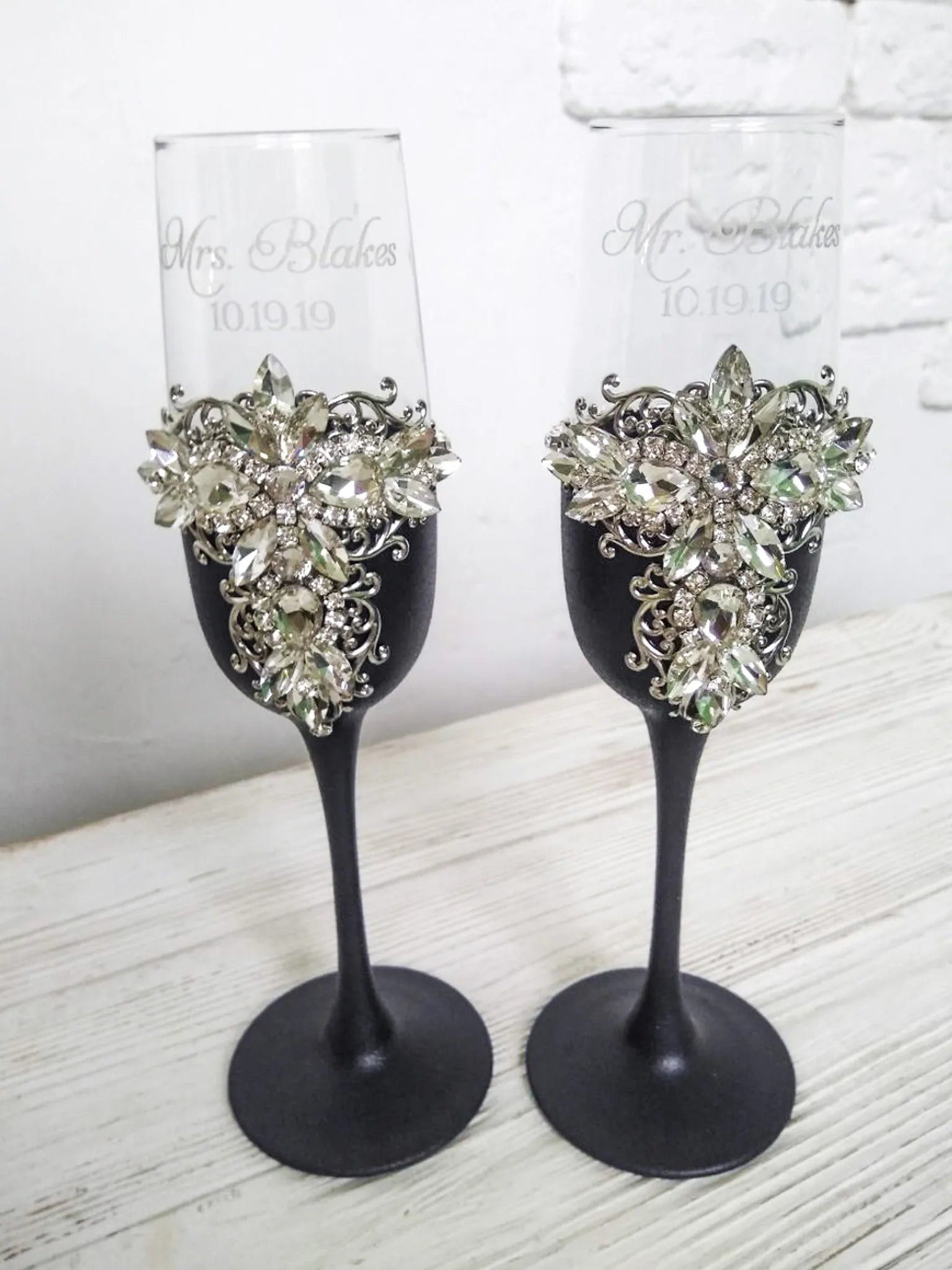 Elegant matte black and silver crystal champagne flutes