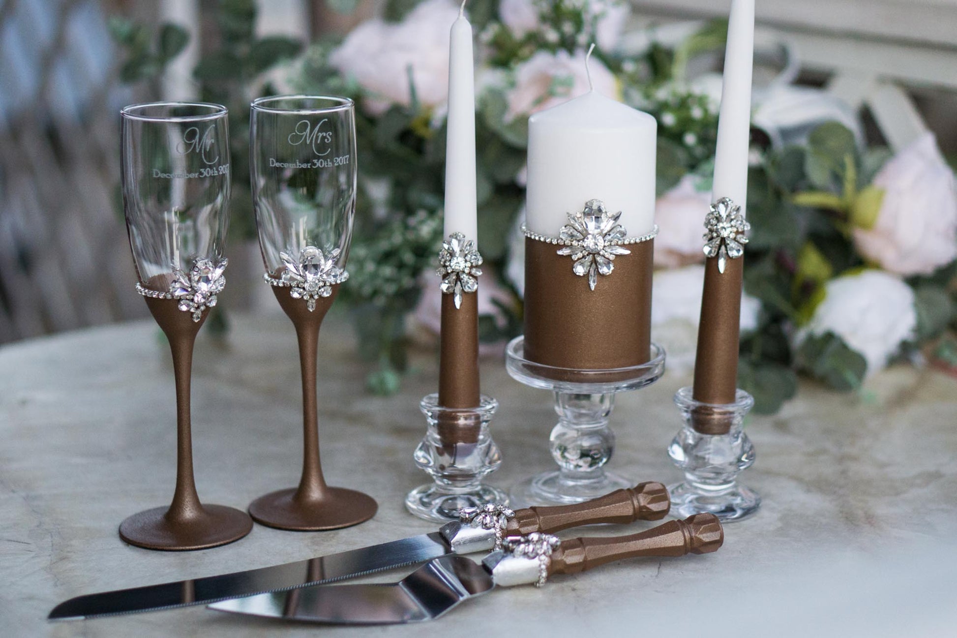 Art Deco-inspired chocolate wedding toasting flutes and cake servers