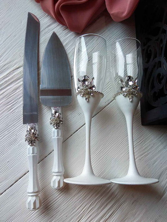 White and silver wedding champagne flutes and cake server set