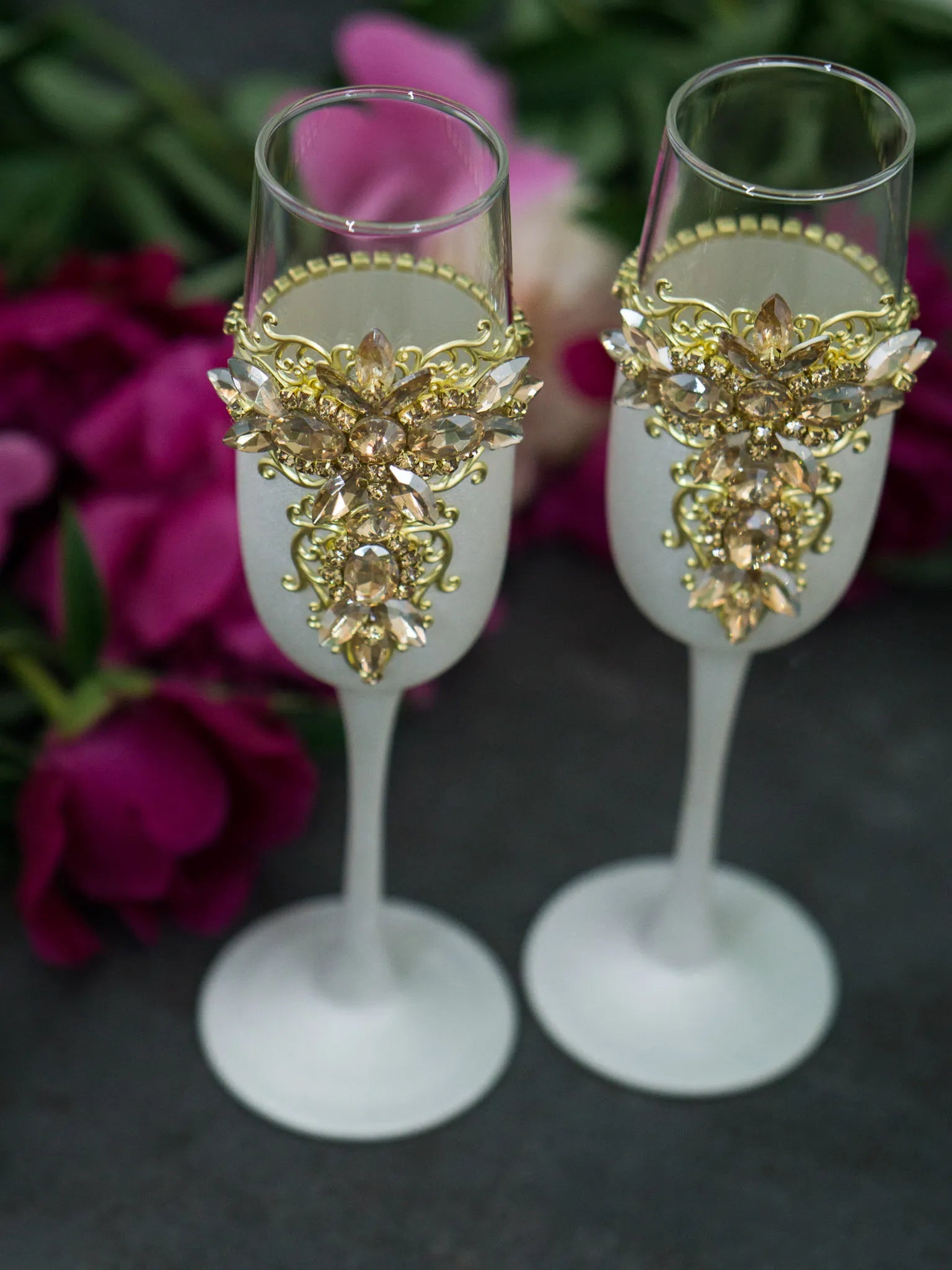 Gold and white champagne glasses for weddings and anniversaries