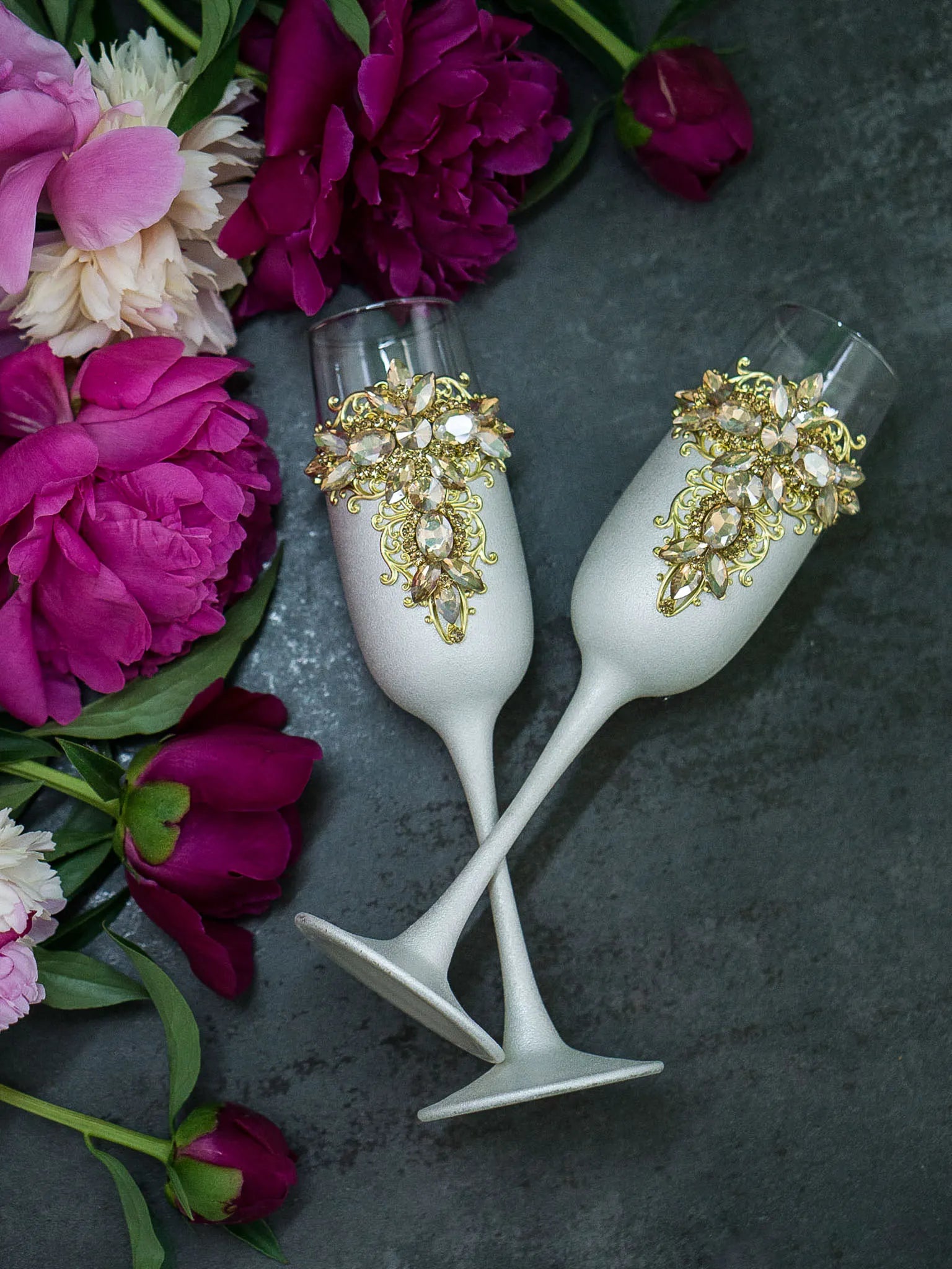 Engraved wedding champagne flutes with pristine white metallic paint