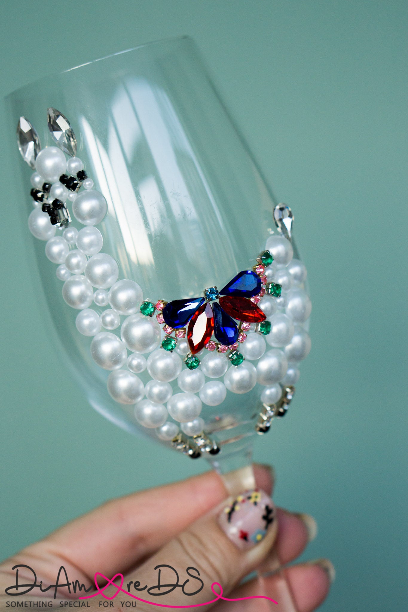 Butterfly adorned wine glass