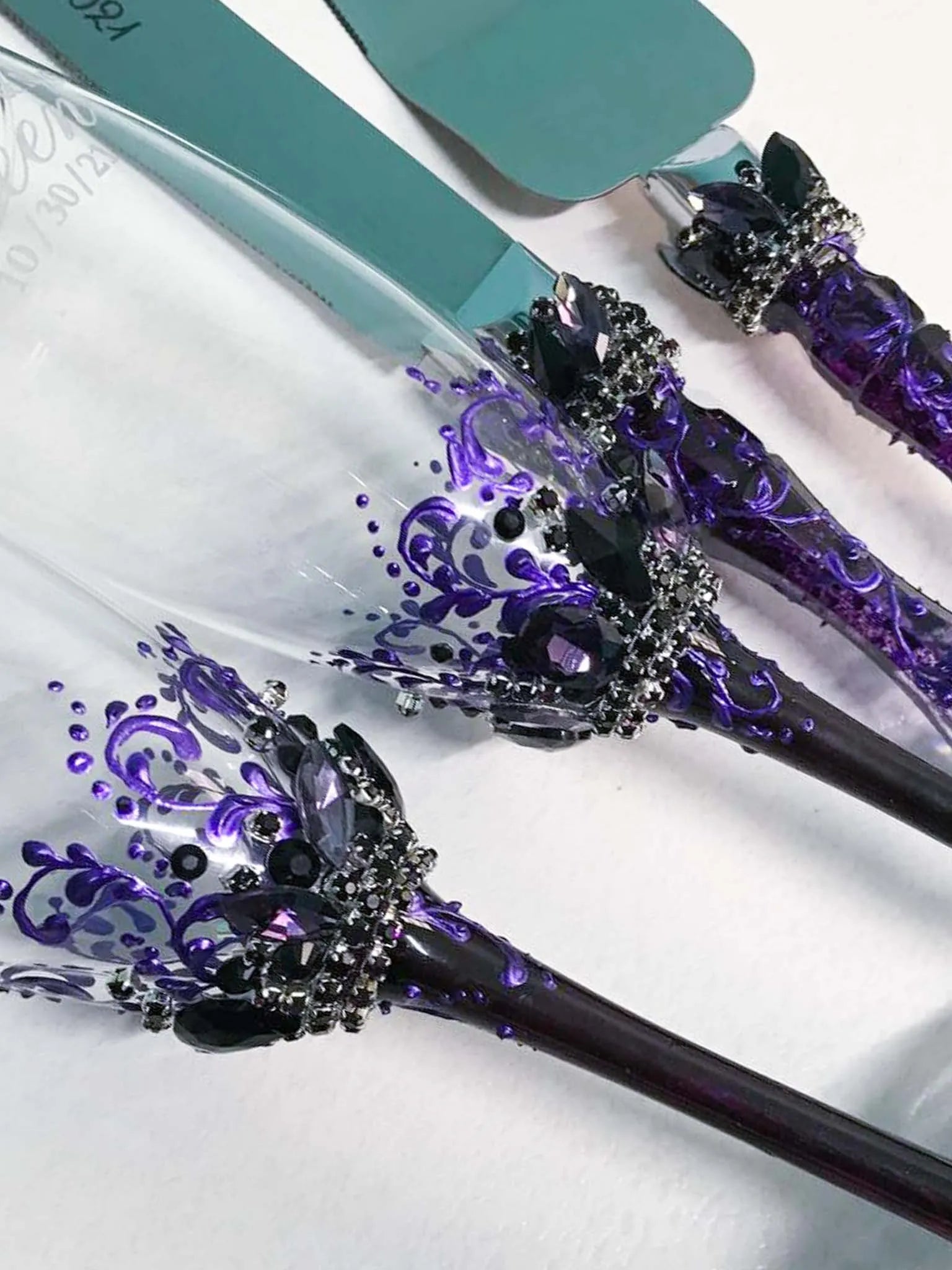 Purple-themed Victoria Collection wedding champagne flutes and cake server ensemble