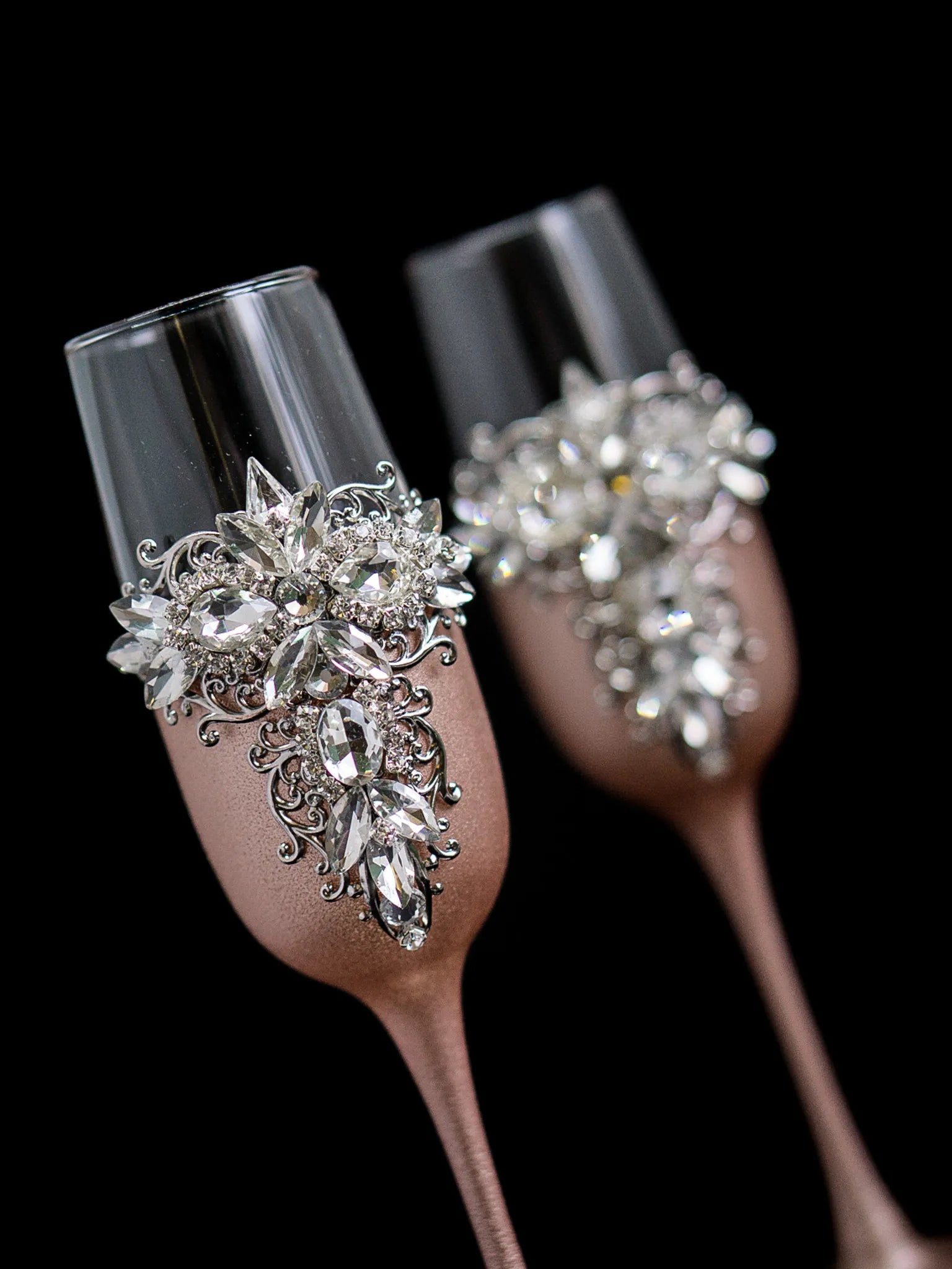 Elegant champagne flutes with silver-colored crystals