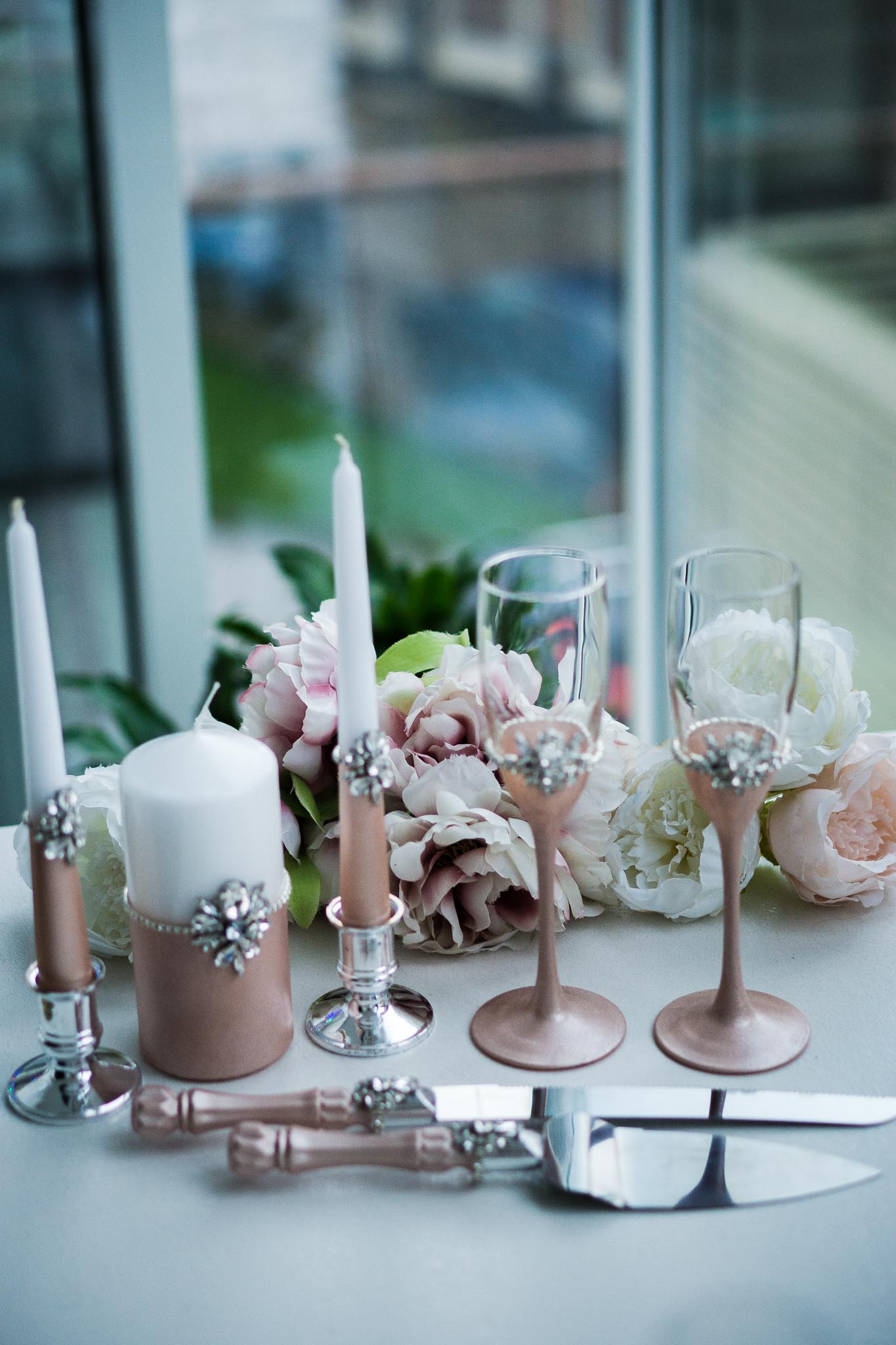 Sophisticated rose gold unity candle set, handcrafted for your special day."