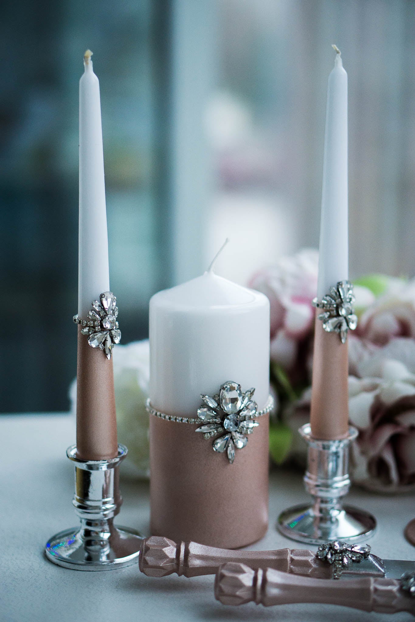 Personalized rose gold wedding candle set with elegant engravings.