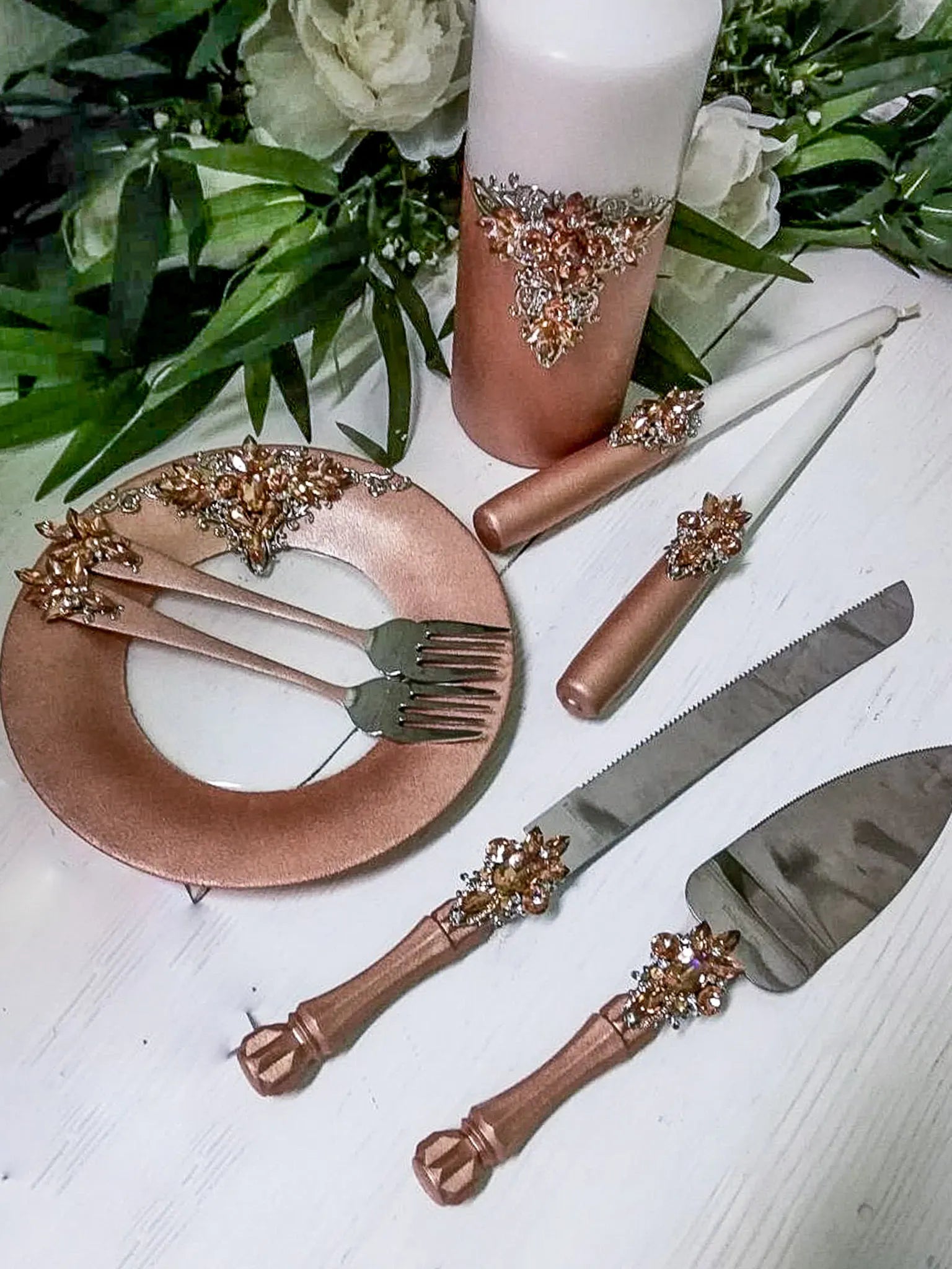 Wedding flutes adorned with rose gold crystals