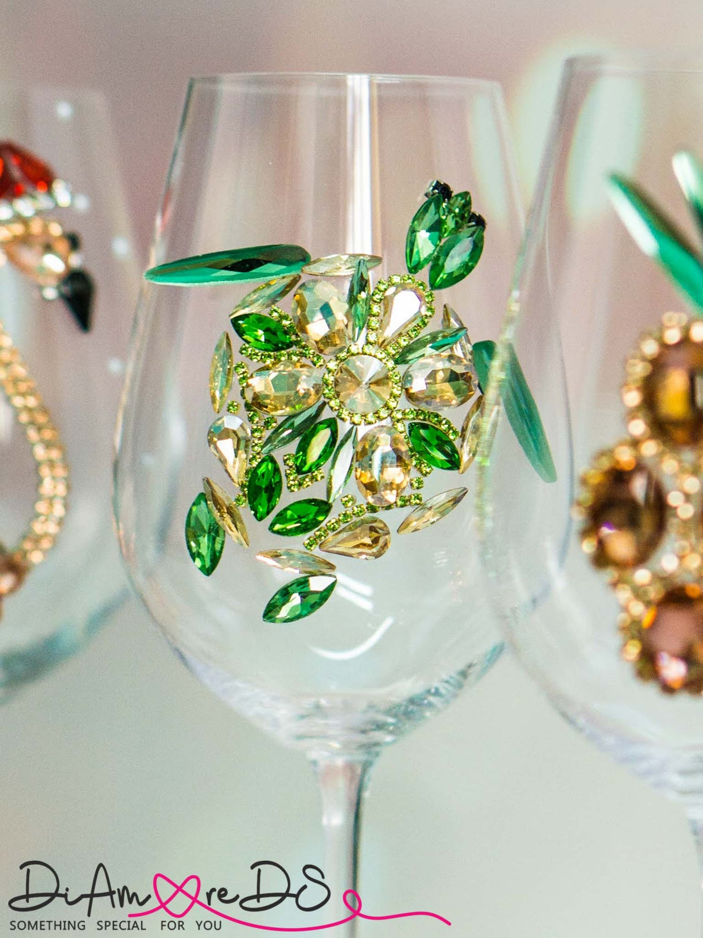 Artisanal wine glass with a sea turtle motif, handcrafted with green and gold crystals for a luxurious feel.